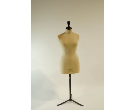 A Stockman of Paris-London Tailors dummy; Female linen clad torso, on a metal tripod stand