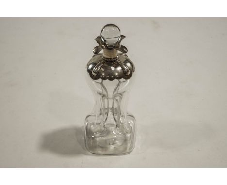 A silver mounted 'glug-glug' decanter with clear glass stopper, London 1898, 30cms high, 
