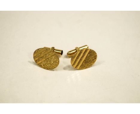 A pair of 9 carat gold cufflinks, by Freddie Manshaw, London 1968, with oval diamond cut panels, 7.7 g gross