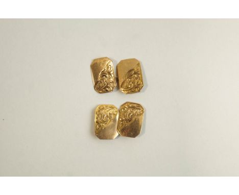A pair of cufflinks, stamped '9ct', the rectangular cut corner panels, half engraved, with chain connectors, 3 g gross, cased