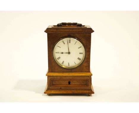 A walnut cased mantel clock, with brass carry handle and bun feet, 20cm high