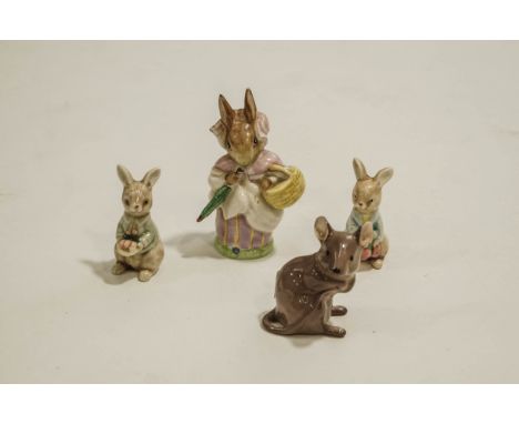 A Beswick Beatrix Potter Mrs Rabbit figure to include a Beswick model of a mouse and two un-marked ceramic models of rabbits 