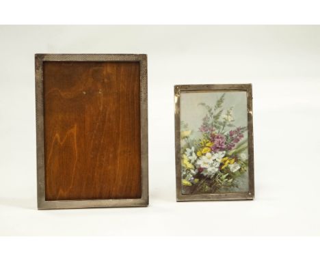 An engine turned silver mounted rectangular photograph frame, Birmingham 1926 by Sanders and Mackenzie, 25.5cm high, together
