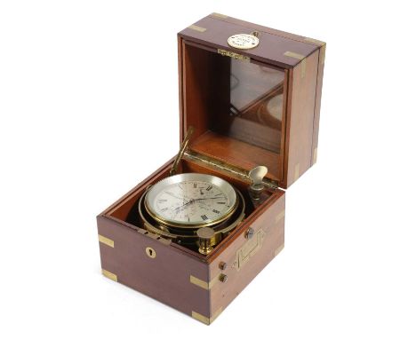 λ λ A MAHOGANY CASED TWO DAY MARINE CHRONOMETER LATE 19TH CENTURYthe brass movement on a four inch silvered dial with Roman n