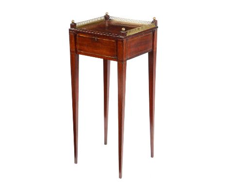A NORTH EUROPEAN MAHOGANY URN STAND FIRST HALF 19TH CENTURYinlaid with brass stringing and with a pierced gallery, above a dr