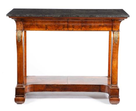 A FRENCH CHARLES X WALNUT CONSOLE TABLE C.1825with ormolu mounts, the rectangular marble top above a pair of curved fronted f