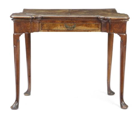 A GEORGE I WALNUT CONCERTINA ACTION CARD TABLEC.1720-25the fold-over burr veneered top with protruding front corners revealin