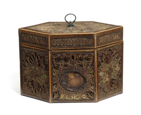 A GEORGE III ROLLED PAPER TEA CADDYLATE 18TH CENTURYof hexagonal form, worked with panels of polychrome and gilt scrollwork w