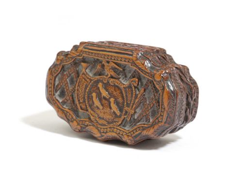 A FRENCH TREEN BOXWOOD SNUFF BOX EARLY 18TH CENTURYof cartouche form, the pull-off cover carved with a central armorial of th