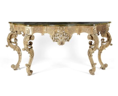 A ROCOCO CARVED WALNUT CONSOLE TABLE POSSIBLY GERMAN OR ITALIAN, 18TH CENTURY AND LATERthe later simulated green marble serpe