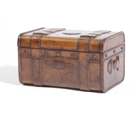 A FRENCH TREEN FRUITWOOD NOVELTY BOX LATE 19TH CENTURYin the form of a trunk with carved straps and handles, the hinged lid w