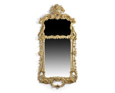 AN EARLY GEORGE III GILTWOOD MIRRORIN THE MANNER OF JOHN LINNELL, C.1760the two plates in a leaf, scroll and rocaille carved 