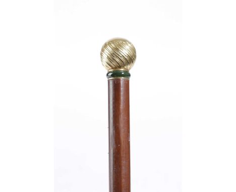 ROYAL INTEREST. A GEORGE V 18CT GOLD AND JADE MOUNTED MALACCA WALKING STICKBY BRIGG, C.1911the finial with wrythen decoration