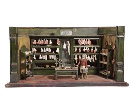 A FOLK ART NAIVE BUTCHER'S SHOP DISPLAY MODELLATE 19TH CENTURYof carved and painted wood depicting the interior of the shop h