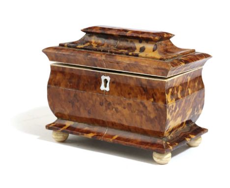 λ λ A REGENCY BLONDE TORTOISESHELL TEA CADDY EARLY 19TH CENTURYof pagoda shape, inlaid with pewter stringing and with bone ed