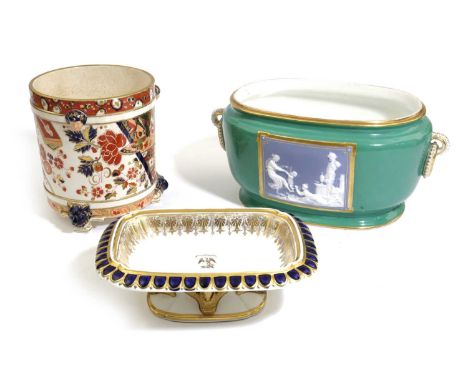 A PARIS PORCELAIN JARDINIÈRELATE 19TH CENTURYof oval form, with a pâte-sur-pâte panel between a pair of hoop handles, inscrib