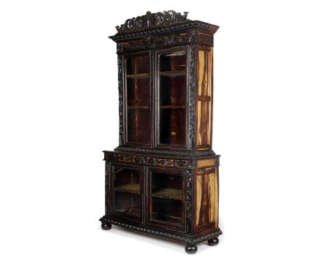 AN ANGLO-INDIAN EBONY AND CALAMANDER DISPLAY CABINETGALLE DISTRICT, CEYLON, SECOND HALF 19TH CENTURYcarved with scrolls, leav