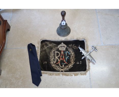 A vintage hand bell, possibly a scramble bell with arrow mark to the handle, together with a 1943 RAF souvenir silk for Egypt
