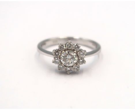 A good quality 18ct white gold diamond cluster ring - colour approx F/G, SI1 - diamonds are well matched, bright and lively -