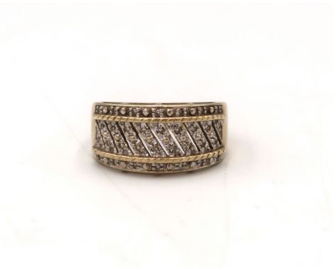 A 9ct gold bi colour band dress ring with single cut diamond highlights. Size R 1/2. Weight 5.35 grams