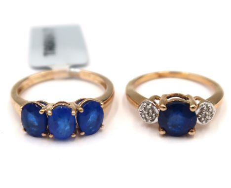 An oval blue spinel three stone ring. Size O. Together with a circular blue spinel and single cut diamond panel ring. Size M.