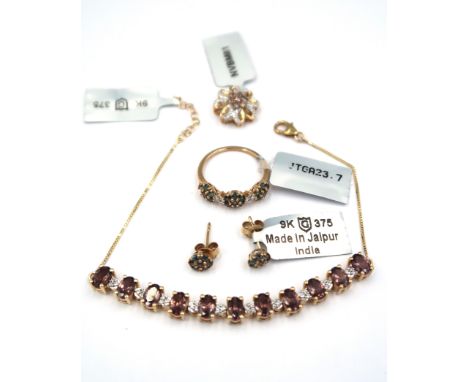 Four pieces of 9ct gold Miova Loko garnet jewellery. To include a pair of cluster ear studs. A ring composed of three circula