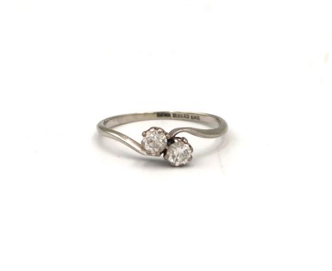 A brilliant cut diamond two stone crossover ring. Estimated total diamond weight 0.40ct, G/H colour, VS2/SI1 clarity. Size R.