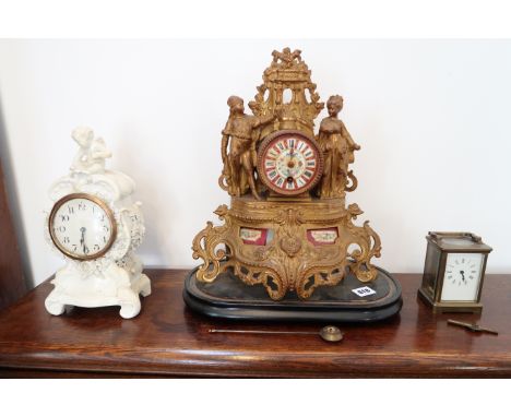 A carriage clock, a French ormulu clock and a mantle clock.
