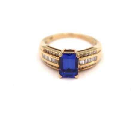 An 18ct yellow gold tanzanite and diamond ring - tanzanite is approx 1.75ct and a very good colour, diamonds are channel set 