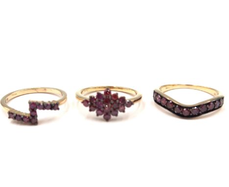 Three 9ct gold irradiated purple diamond rings. To include a brilliant cut purple wishbone ring. Stated diamond weight 0.52ct