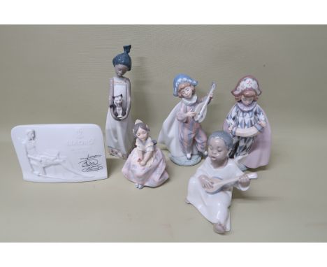 Five Lladro figures including Number 4537 Black Angel 'Lolita' Valencian girl number 5372, 'Close to my heart 5603, 5695 Conc