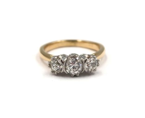 An 18ct yellow gold three stone old cut diamond ring - centre stone approx 0.65ct - total diamond weight approx 1.15ct - colo