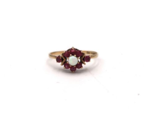 A 9ct gold, opal and garnet set flowerhead ring, size J, 1.4g