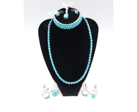 Eight pieces of silver turquoise jewellery. To include two three stone rings with white zircon highlights. Size M. A single s
