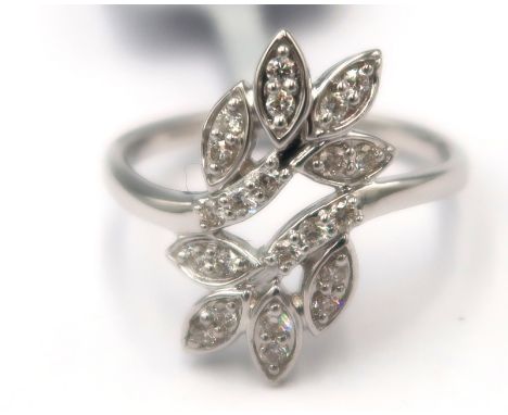 A 9ct gold leaf crossover ring set with brilliant cut diamonds. Stated diamond weight 0.25ct. Size M. Weight 2.60grams.