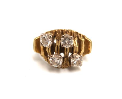 An 18ct yellow gold (marked) four stone diamond ring size Q/R - approx weight 7.9 grams - each diamond approx 4mm diameter x 