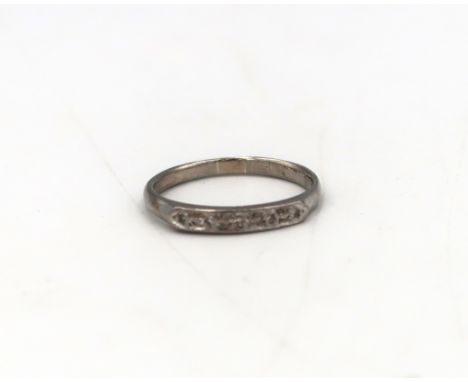 A diamond highlight five stone ring, size Q, stamped 18ct. Weight 2.71 grams