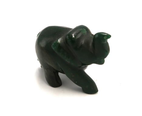 A carved jade elephant, approximately 9 by 5 by 7cm high.