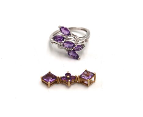 A 9ct white gold, hallmarked amethyst and diamond dress ring, size K, 2.6g, and a 9ct gold and amethyst pendant, 2.3cm long.