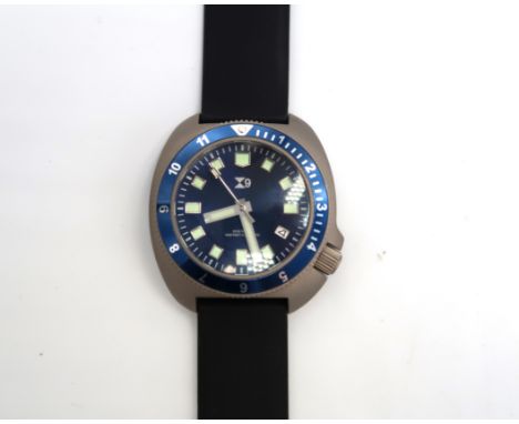 A TC9 Turtle divers watch in titanium case with rubber strap, dark blue face with baton markers, 4.1cm across bezel, running 