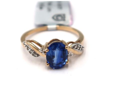 A 9ct gold oval kyanite ring with single cut diamond shoulders. Size O. Weight 2.31 grams.