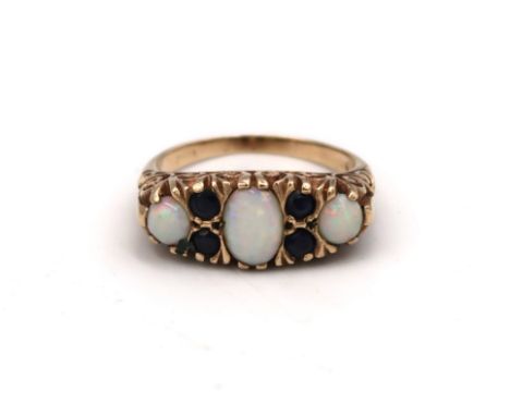A 18ct yellow gold dress ring sapphire and opal to shoulder, 4.8 grams, size N/O
