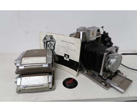 A Linhof Technica camera with F2.8/100 Planar lens and two film backs.