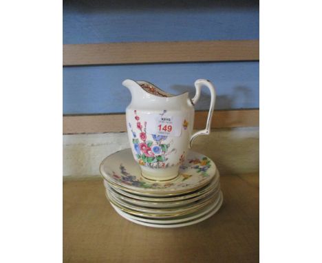 CROWN STAFFORDSHIRE JUG AND QUANTITY OF SAUCERS