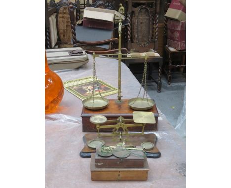 THREE SETS OF BRASS BALANCE SCALES AND SET OF POSTAL SCALES WITH WEIGHTS PLUS SET OF GOLD SCALES WITH WEIGHTS 