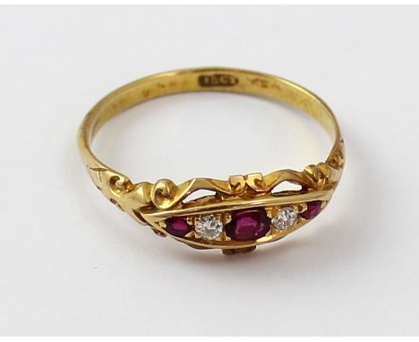 An 18ct gold Edwardian-style dress ring set with central red stone with red and white stone to either side, size R, approx 2.