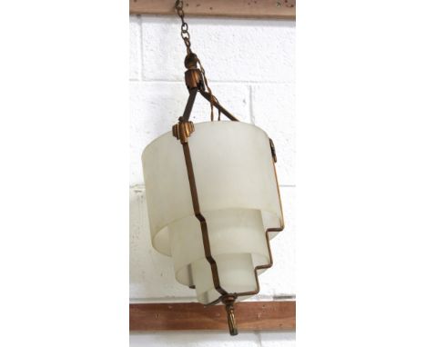 An Art Deco brass three-tier pendant light with circular glass shades, height 53.5cm.