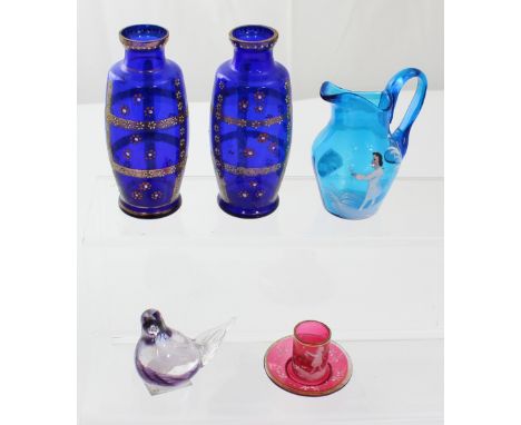 A 19th century Mary Gregory style blue glass jug decorated with a girl picking flowers, a similar glass can and saucer, a pai