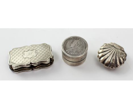 A small silver serpentine vinaigrette by Nathaniel Mills, date marks obscured (grille af), width approx 4cm and a scallop-for