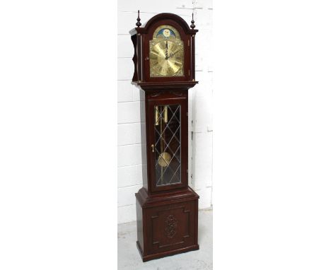 A modern reproduction oak longcase clock with rolling moon, Roman dial, striking on the quarter, with a selection of chimes i